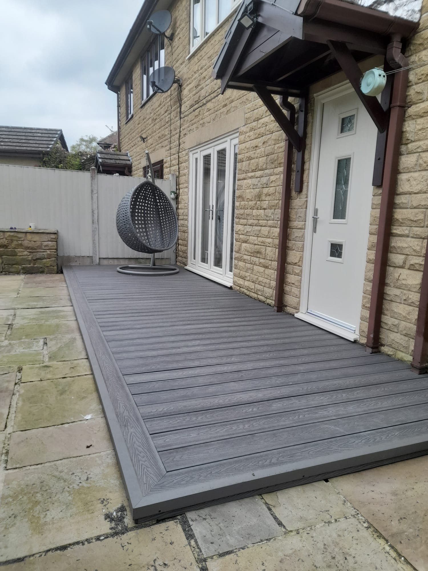 Composite decking with picture-frame border installed by Greenside Joinery