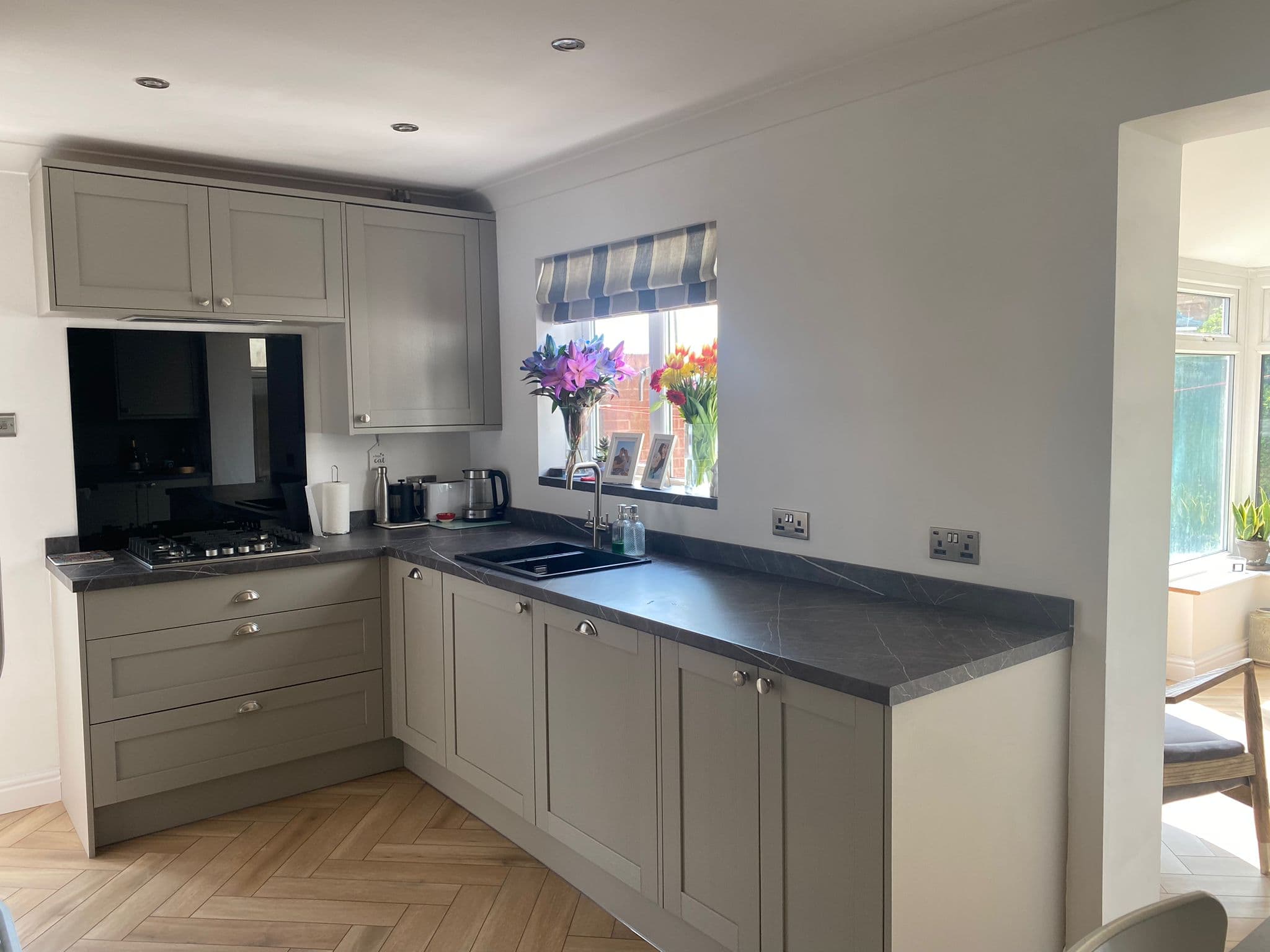 Grey shaker kitchen with dark worktops fitted by Greenside Joinery in Barnsley